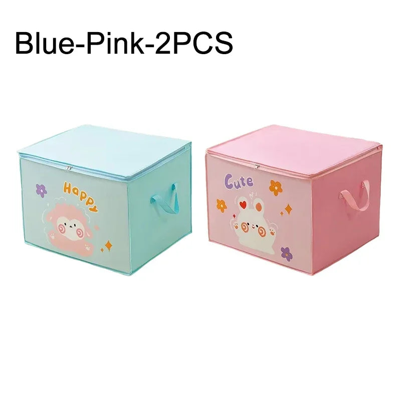 Two pink and blue storage boxes with cute designs for folding clothes and quilts