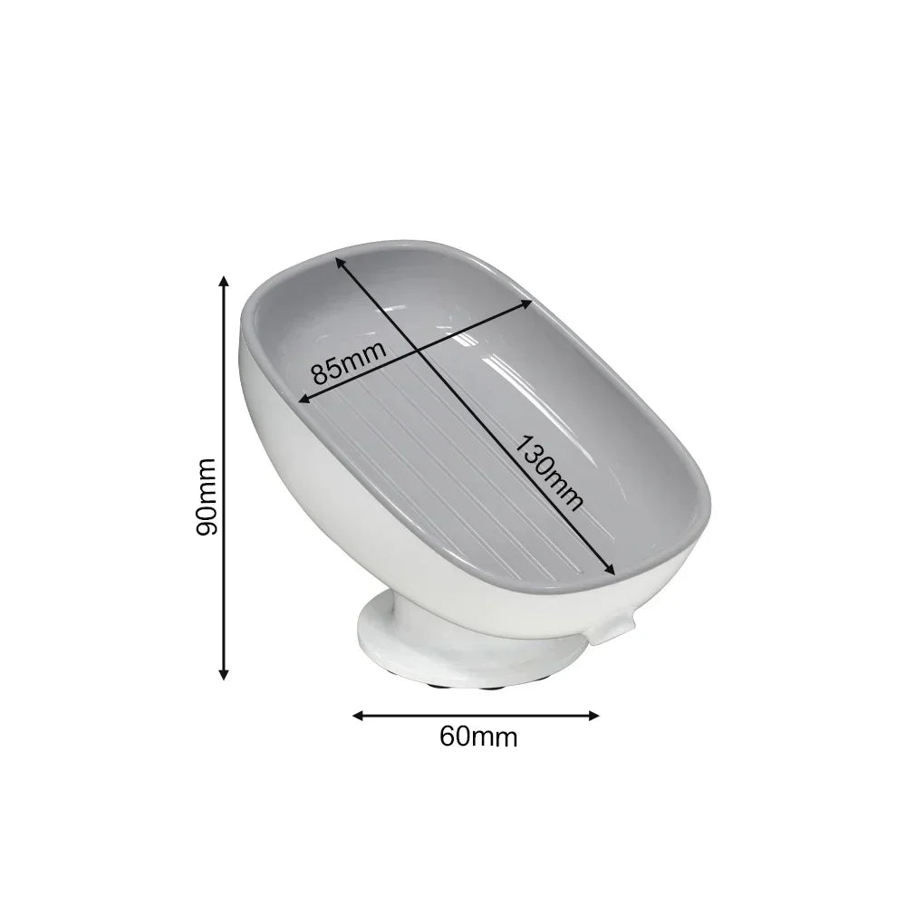White suction cup soap dish with a shallow oval bowl and a flat base.
