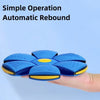 A blue magic flying saucer bouncing ball is held in a hand, demonstrating a simple operation automatic rebound feature.