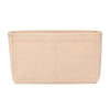 A light beige soft felt handbag organizer insert with multiple pockets.