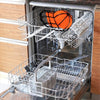 A set of three wire washing cages for baseball caps, including an orange ball, inside a washing machine.