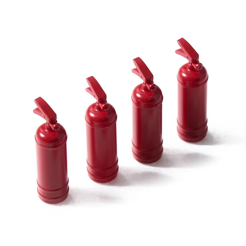A set of three red RC car decorative accessories, including a surfboard, kayak, and roadblock.