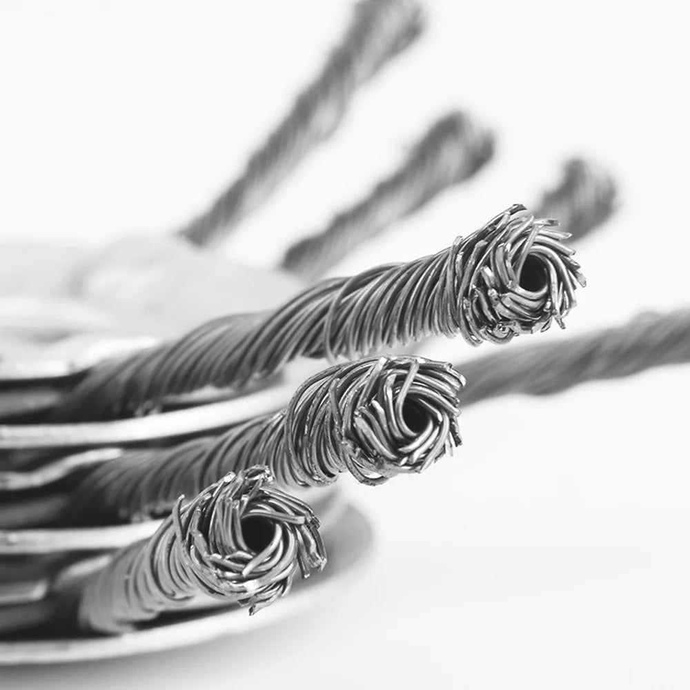 Close-up of steel wire trimmer brush heads with fine, twisted wires against a white background.