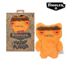 An orange plush toy of a monster with furry features and funny teeth, packaged in a brown box.