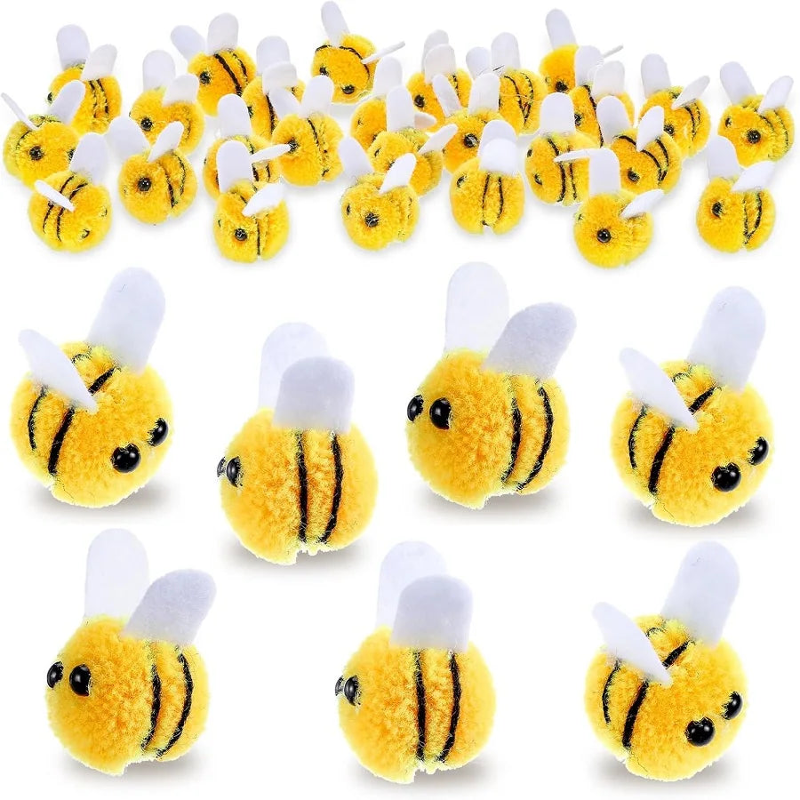 A collection of yellow wool felt bee pompoms used for crafts and party decorations.