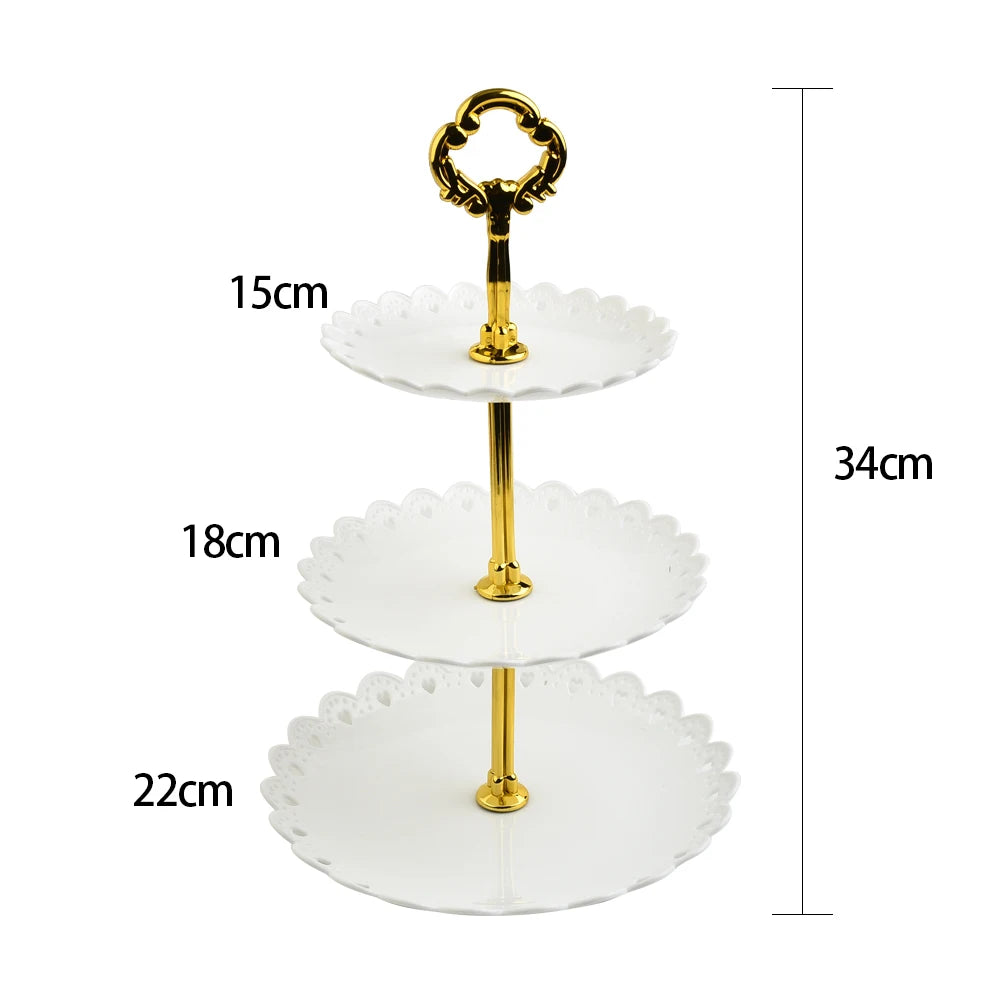 A three-tier gold-colored acrylic cake stand with varying diameters and height measurements.