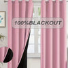Pink blackout curtain panels hanging in a window frame.
