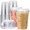 A stack of clear PET disposable cups with lids and a glass of iced coffee.