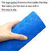 A hand is holding a blue, textured non-slip pool ladder mat.