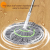 A cleaning tool with a lotus leaf water-repellent layer is shown cleaning a textured gray scrubbing pad on a wooden floor.