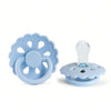 A light blue silicone baby pacifier with a flower-shaped silicone ring and a clear silicone nipple.
