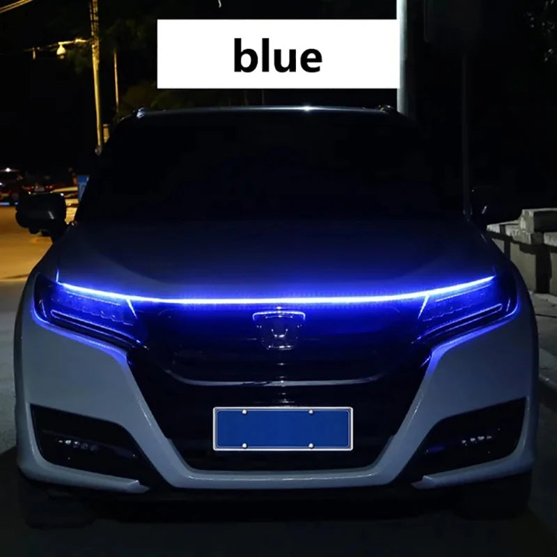 A blue 12V LED engine hood light strip with a scan effect on the front of a car.