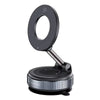 A black magnetic car phone mount with a circular opening and a rotating base.