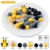 A collection of 45 round silicone beads in yellow, black, and gray colors for jewelry making.