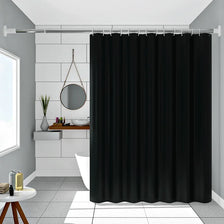 Solid black waterproof PEVA shower curtain hanging on a rod in a bathroom