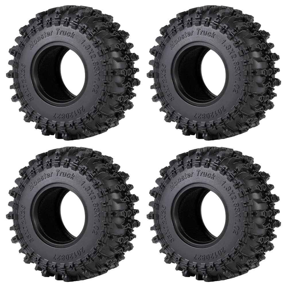 Four black Monster Truck mud terrain rubber tires for RC crawlers shown from different angles.