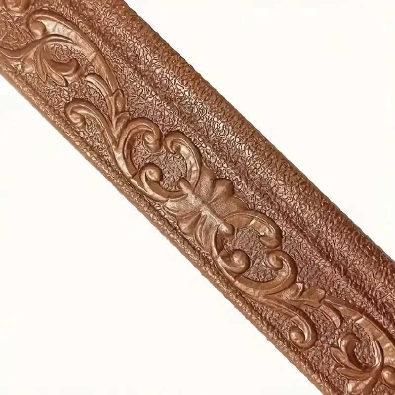 Close-up of a textured, bronze-colored foam wall trim border sticker with an ornate scroll design.