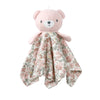 A pink stuffed animal with a floral patterned fabric draped over its chest.