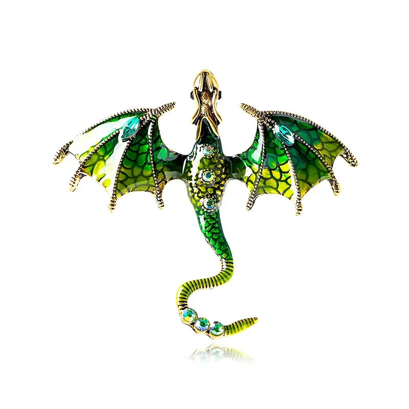 A detailed enamel dragon brooch featuring green and black scales with rhinestone accents.