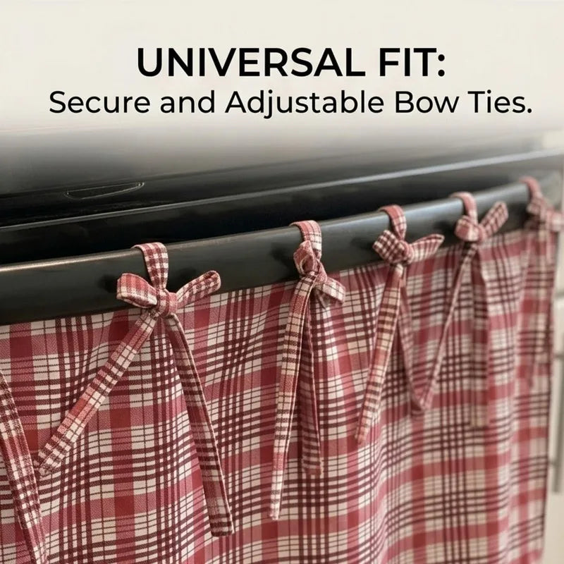 A close-up of a red and white plaid oven skirt with adjustable bow ties hanging on a black rack.