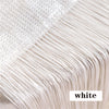 Close-up of white beaded thread curtain fabric showing fine threads and texture.