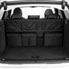 Interior view of a car showing the foldable trunk organizer with seat back storage installed.
