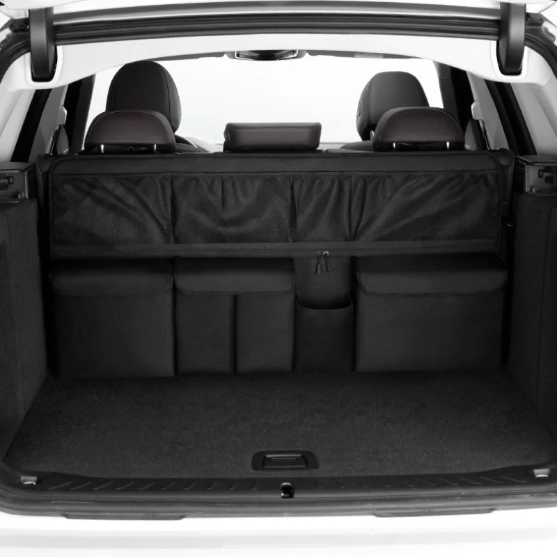Interior view of a car showing the foldable trunk organizer with seat back storage installed.