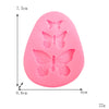 A pink silicone mold shaped like a butterfly for crafting soap, chocolate, or resin.