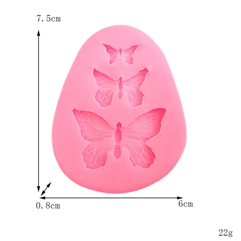 A pink silicone mold shaped like a butterfly for crafting soap, chocolate, or resin.