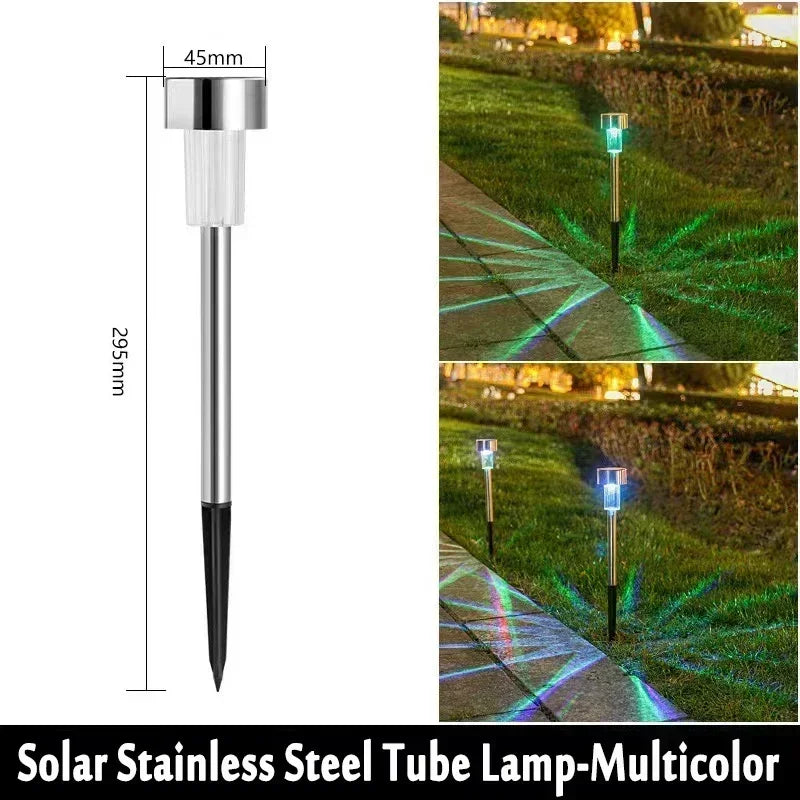 A solar stainless steel tube lamp with multicolor LED lights illuminating a garden path.