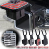 A black trailer hitch receiver cover plug featuring an American flag emblem.