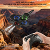A hand holds an LED light foam stunt airplane against a backdrop of a canyon landscape.