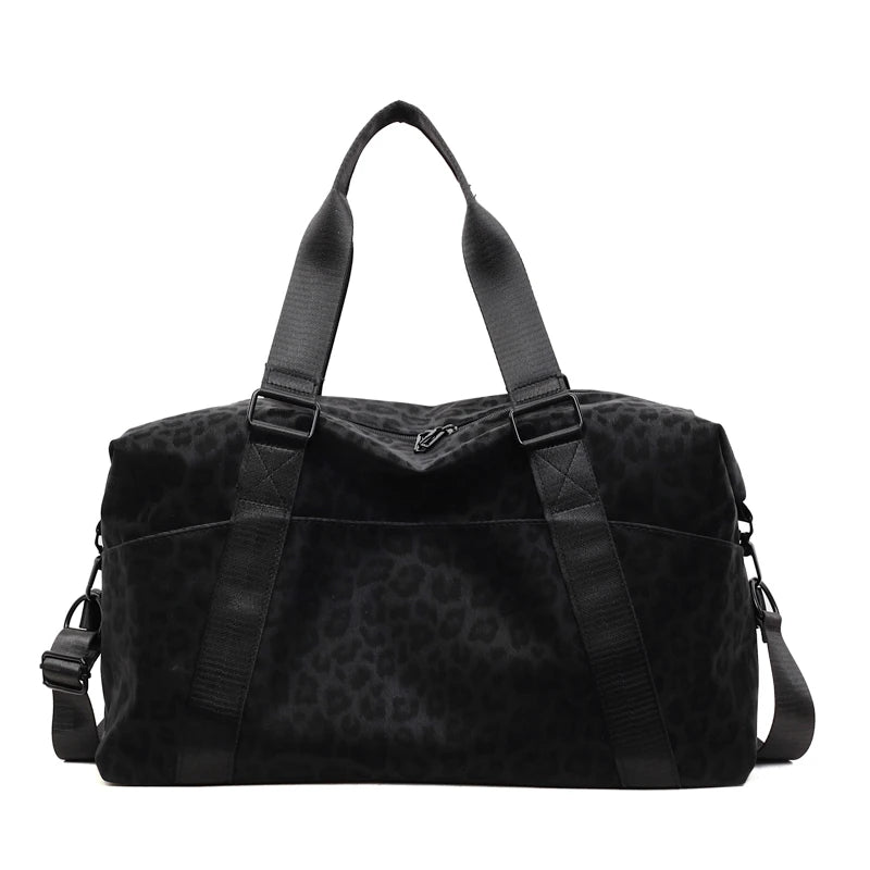 Black leopard print duffle bag with adjustable straps