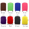 A collection of colored elastic travel luggage covers for suitcases including brown, green, blue, pink, purple, red, black, a
