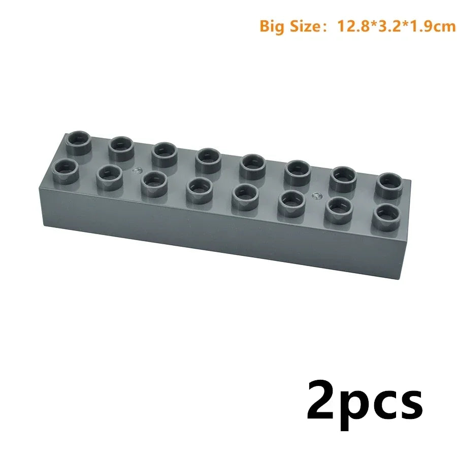 A rectangular gray building blocks set with multiple studs, shown from the side.