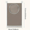 A rectangular beige laundry storage bag with a circular cutout and multiple pockets, shown against a white background.