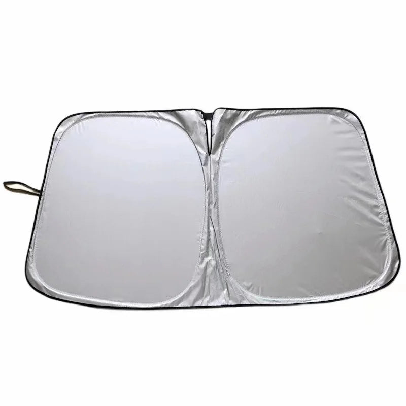 Foldable car windshield sun shade with UV protection, silver reflective material.