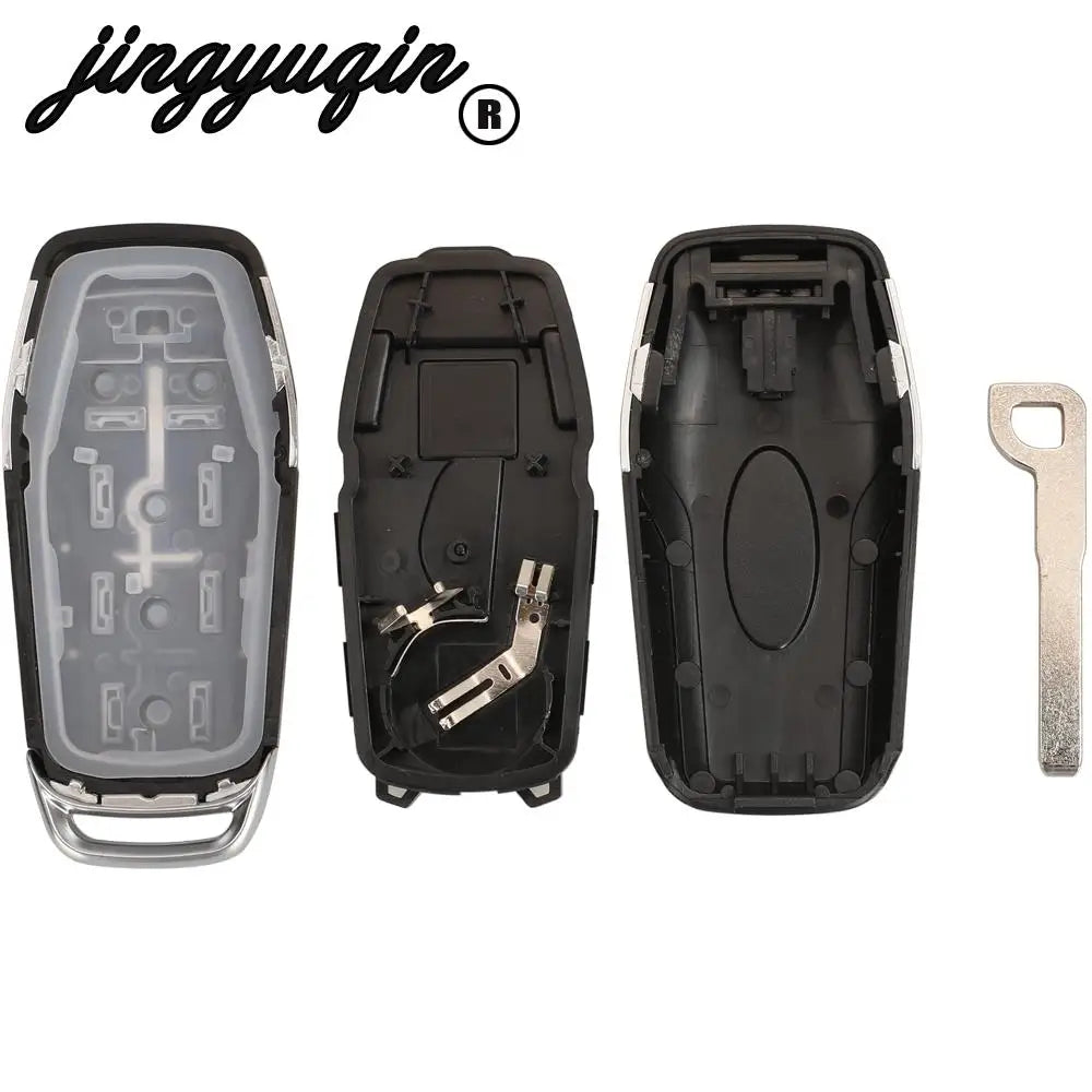 A set of black Ford Smart Key replacement shells and an uncut blade for key duplication.