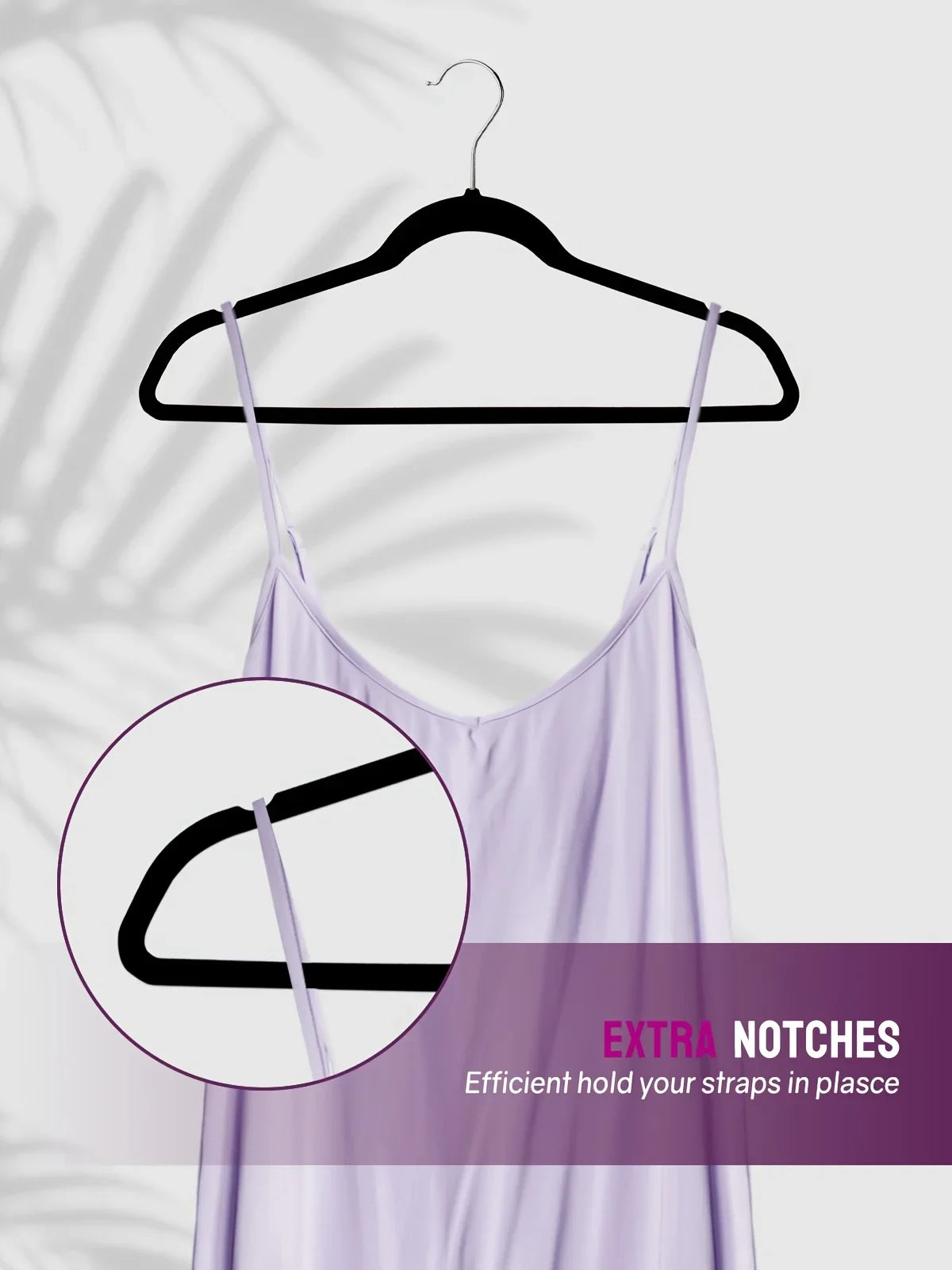 A lavender velvet hanger with rotating hooks is displayed against a light background.