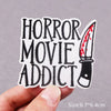 Black embroidered patch with the text Horror Movie Addict and a knife design