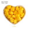 A pile of yellow silicone crown star heart beads for DIY jewelry making