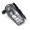 Black front fog light assembly for Cadillac Escalade with clear bulbs.