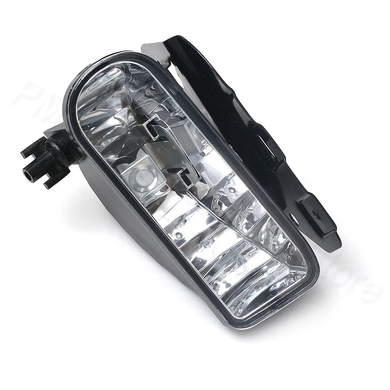 Black front fog light assembly for Cadillac Escalade with clear bulbs.