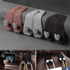 Set of three leather car seat headrest hooks with dual hearts for securing bags and phones