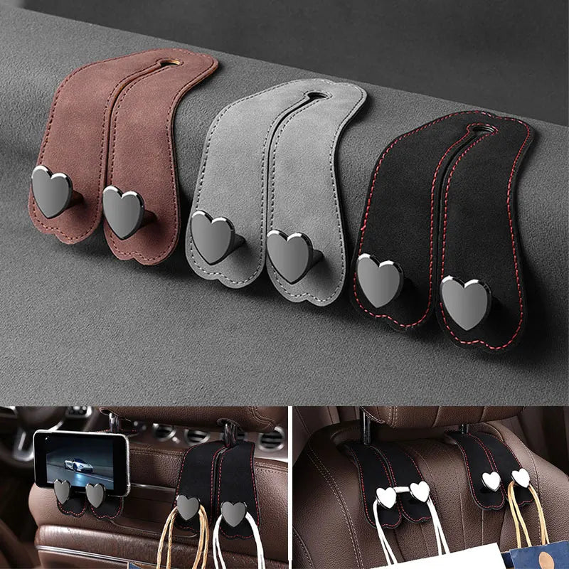 Set of three leather car seat headrest hooks with dual hearts for securing bags and phones
