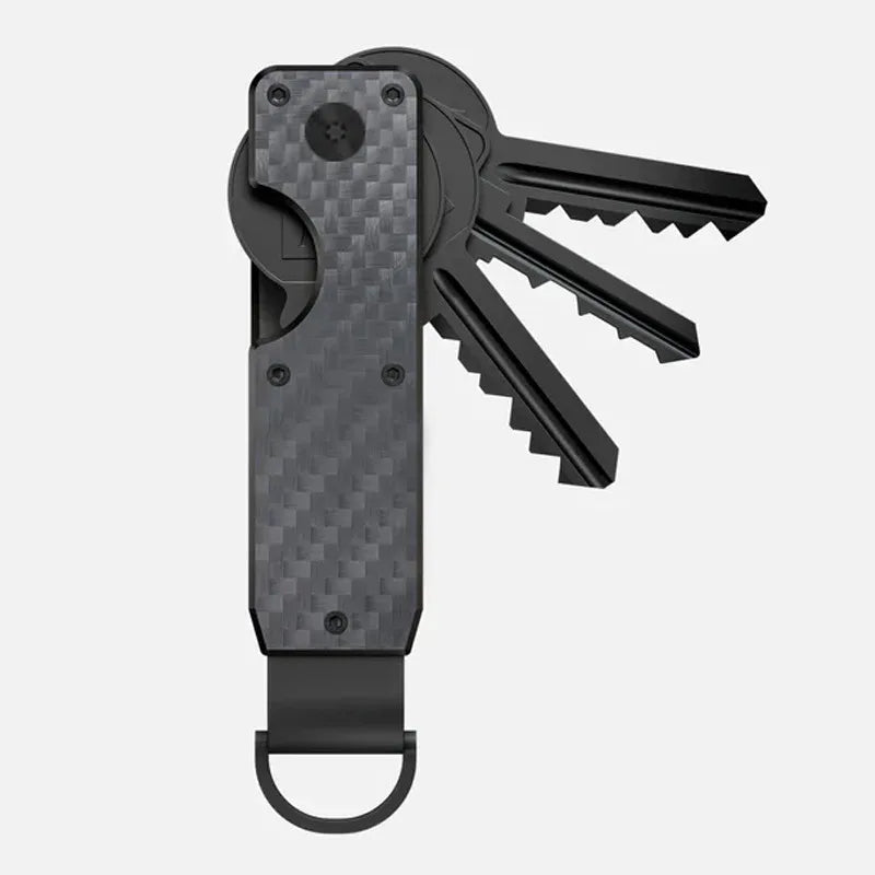 A black minimalist aluminum key organizer with a slot for holding keys and a handle.