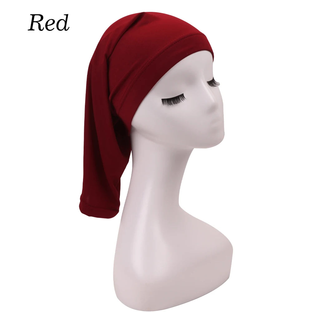 A red stretchable spandex dreadlock tube hair protection cap displayed on a white mannequin head.