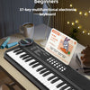 A close-up of a black 37-key multifunctional electronic keyboard with a microphone resting on a wooden desk.