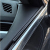 Close-up view of black car side window wiper strips and trim on a vehicle.
