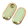 A light green luxury leather key case with a gold rim and slots for keys.